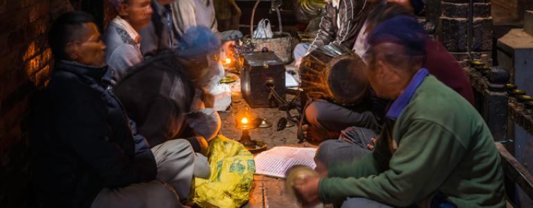 Men In Nepal sitting in candlelight.jpg