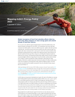 Mapping India's Energy Policy 2023 report cover showing a person maintaining a solar panel.